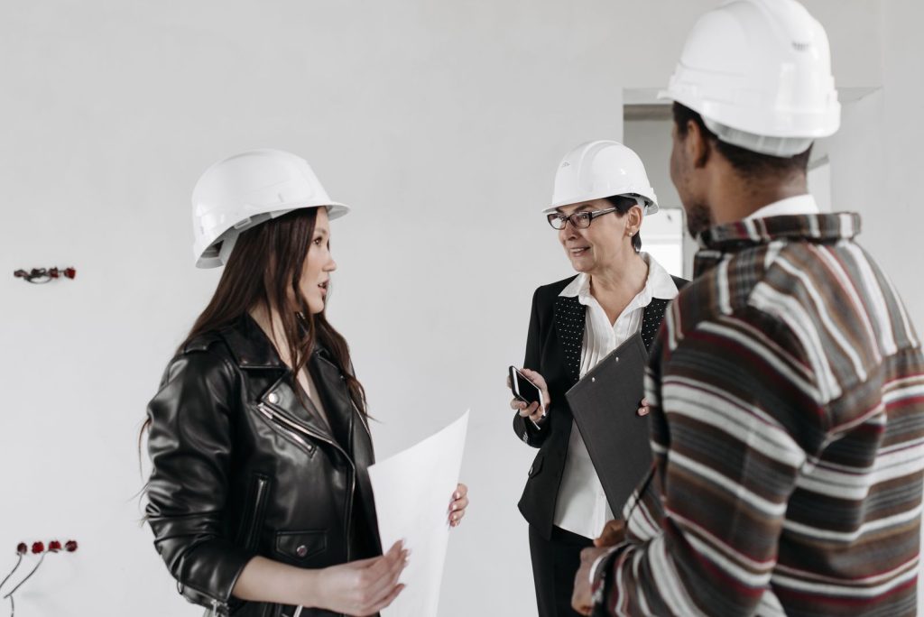 Tenant improvement plumbing contractors reviewing plans